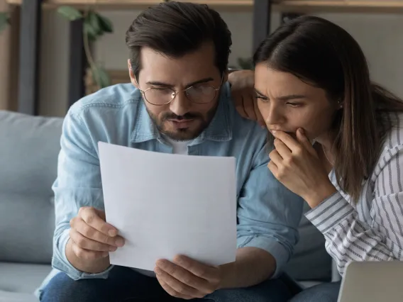 Couple looking at paper statement