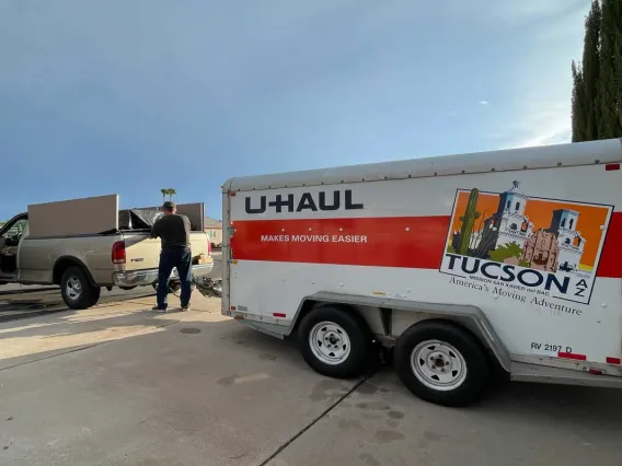 Man standing driveway moving truck