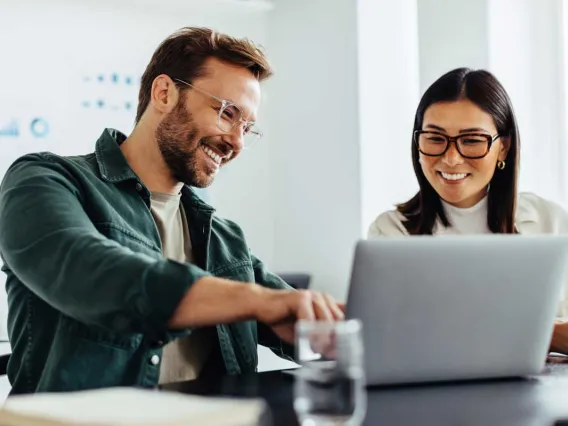 Man and Woman watching computer