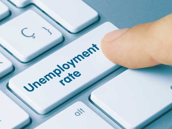 Person pressing unemployment rate button