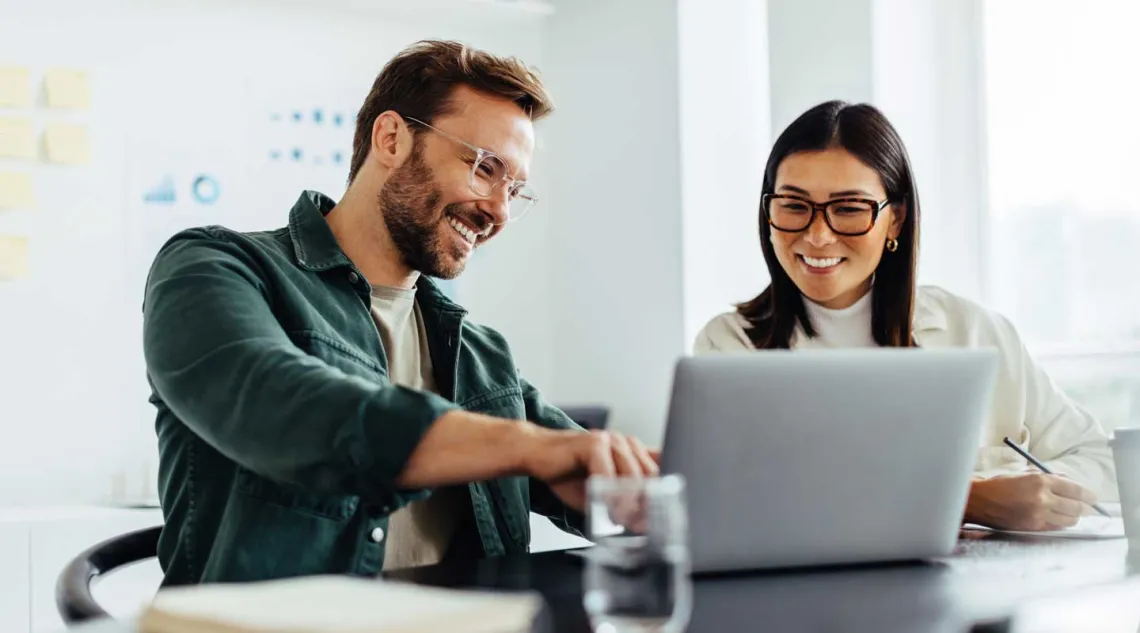 Man and Woman watching computer