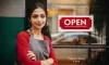 Woman standing business door